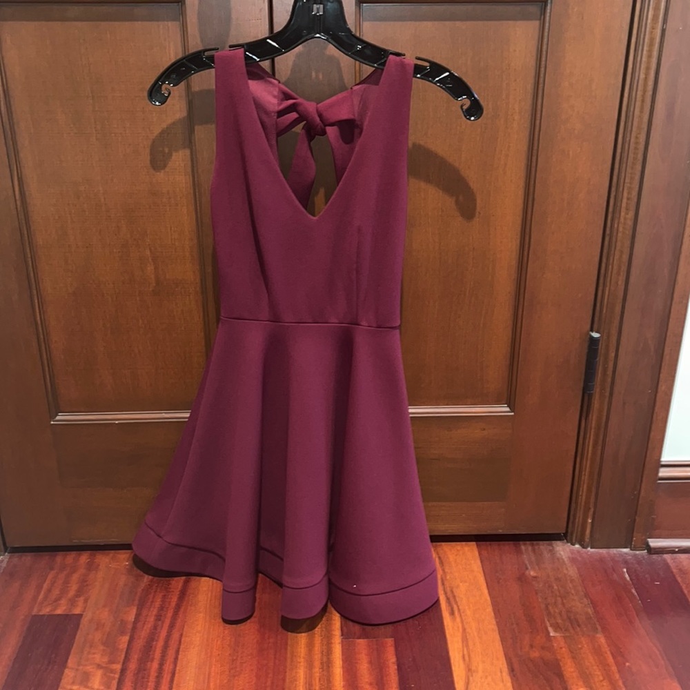 Maroon dress. Size 0. Tie back and zipper. Worn once. Perfect condition!
